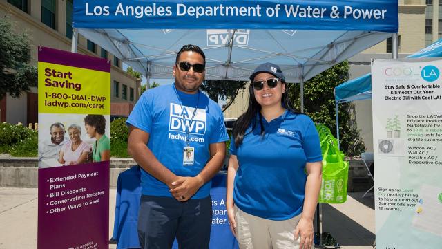 Two  persons standing in front of an LADWP booth