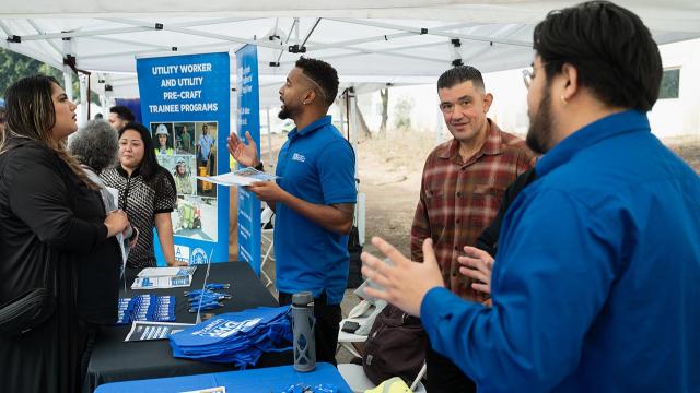 LADWP staff interacting with visitor in an event booth