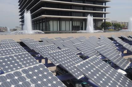 Photo of solar car port with the John Ferraro Building in the background