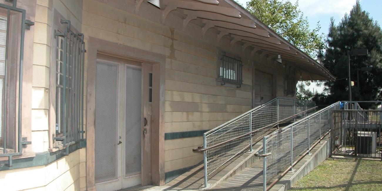 Watts Customer Service Center, housed within the historic Watts Pacific Electric Railway station. West Side (former freight/baggage area)