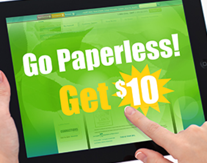 A person holding a tablet. The tablet says, “Go Paperless! Get $10.”