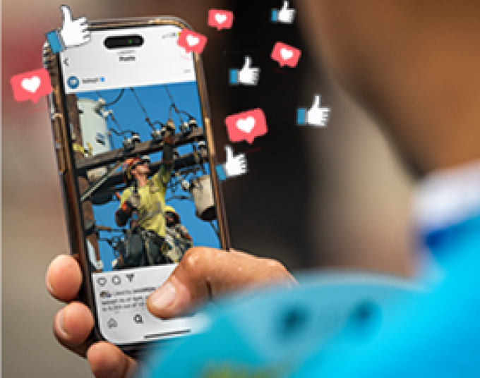 Person holding phone in their hands featuring floating “like” and “heart” social icons.