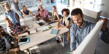 people having a meeting around a table 