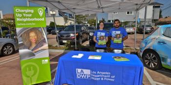 Two employees at an LADWP booth at an event